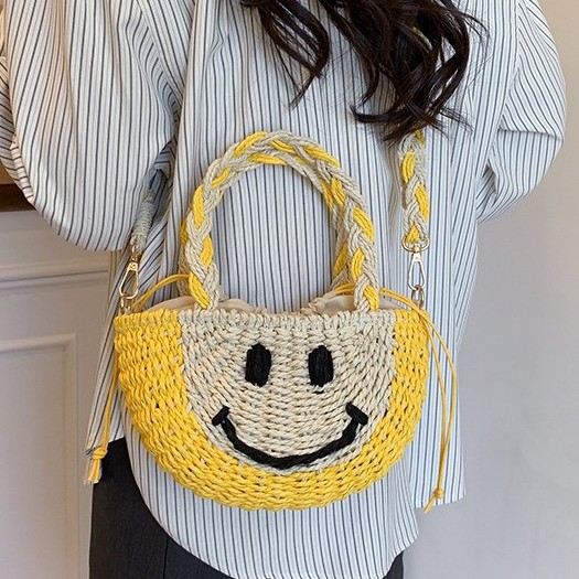 Cute smiling face hand-held straw woven bag, new and fresh bucket straw woven bag, vacation beach bag, versatile women's bag Specification drawing