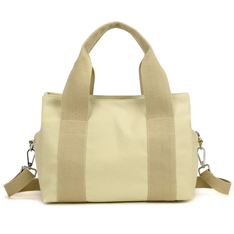 The new solid-color hand-held crossbody bento bag has a large capacity and a small square shape. It is fashionable and trendy. It is a simple and casual single-shoulder crossbody bag for women Item Picture