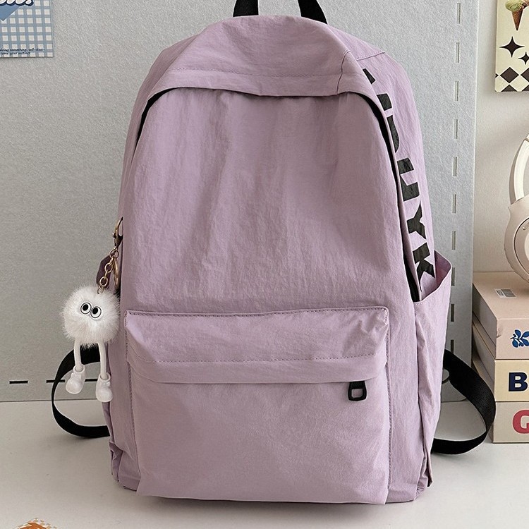A cute student macaron letter backpack for casual students on Instagram. It's a simple, trendy and fresh backpack full figure