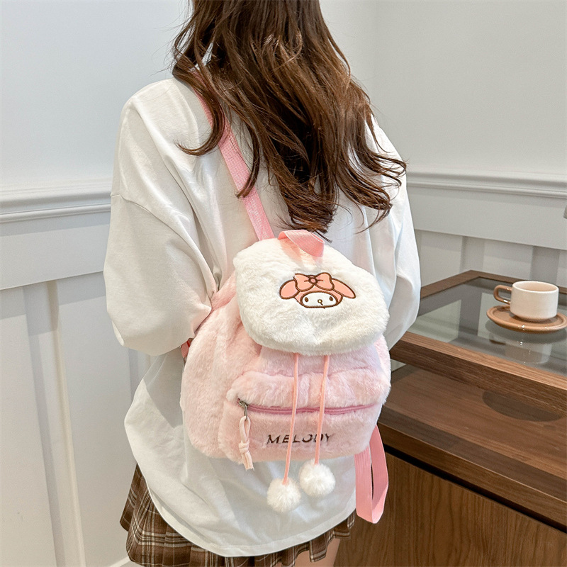 A new cartoon embroidered shoulder plush backpack with large capacity, a soft girl's niche flip cover backpack, and a girlish class bag Application Scenario