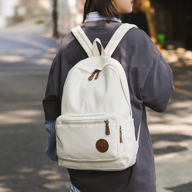 A Japanese-style Harajuku Instagram backpack for junior high school students, solid color corduroy, artistic style, and a couple backpack for college students full figure