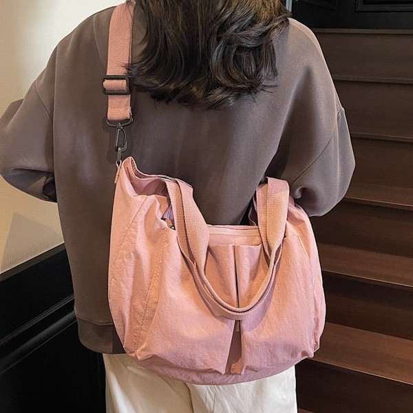 Solid color single-shoulder bag, simple and casual, large-capacity bag, Oxford fabric backpack design, new fashionable and versatile commuting bag full figure