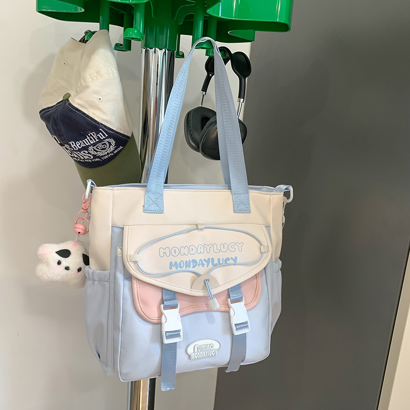 High appearance level Korean-style fresh and simple single-shoulder bag for junior high school students, color-blocking handbag, primary school student tutorial bag, canvas crossbody bag Application Scenario