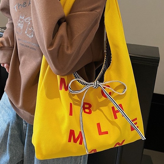 Large-capacity color-blocking striped double-sided canvas bag, 2025 new style color letter bow shopping bag, single-shoulder bag details Picture