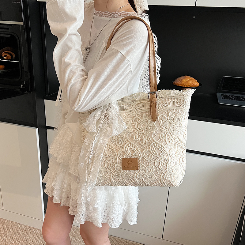 Korean lace bow large-capacity tote bag for women 2025 new style, hollowed-out, versatile and simple single-shoulder armpit bag details Picture