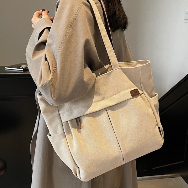 A new best-selling, niche, casual and simple style large-capacity solid-color fabric bag, a versatile single-shoulder women's bag for students' commuting to class full figure