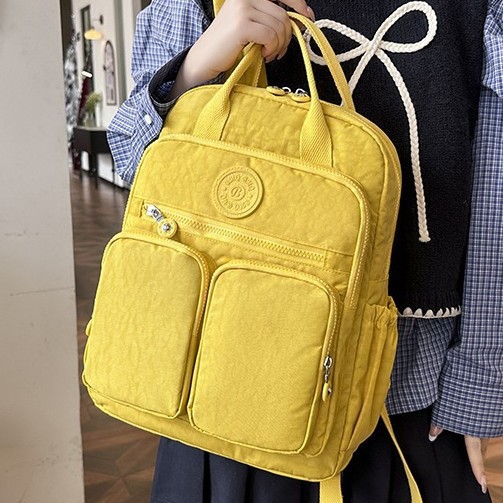 Solid-color Japanese-style women's casual backpack, lightweight nylon multi-pocket waterproof travel backpack, computer bag, multi-functional bag full figure