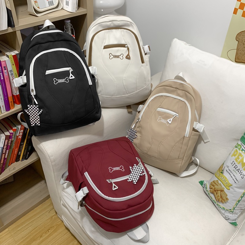 New solid-color Japanese-style backpack for male and female middle school students, large capacity, simple for high school and college students details Picture