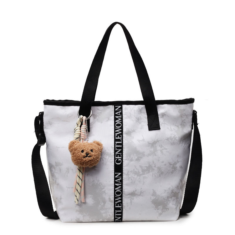 Large-capacity women's 2025 autumn new graffiti tie-dyed canvas handbag, fashionable and casual single-shoulder tote bag Item Picture