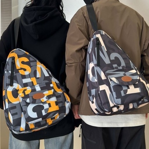 A new large-capacity Japanese versatile single-shoulder bag with contrasting colors, a couple's letter style, a fashionable 2025 chest bag for both men and women, and a crossbody bag full figure