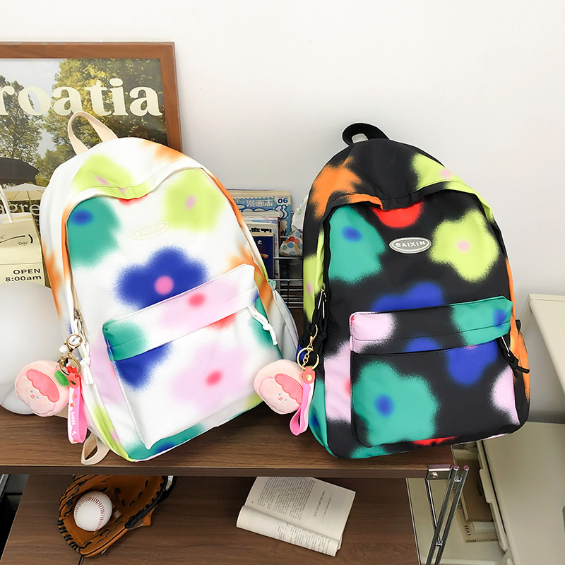 Cute flower junior high school student schoolbag, large-capacity tie-dyed colorful commuting backpack, niche design college student backpack Specification drawing