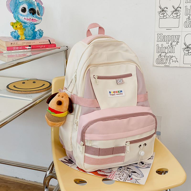 High-appearance-level schoolbag for female college and high school students, cute color-blocking backpack, niche design sense, funny girl backpack details Picture