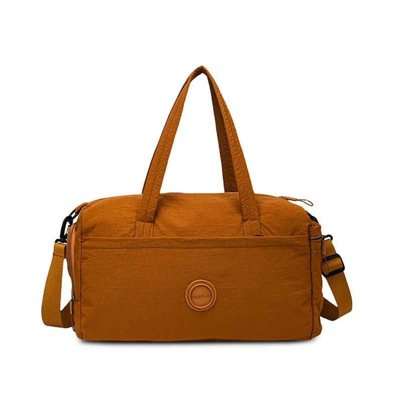 A large-capacity, lightweight and breathable fitness bag for women, a new type of cross-border hand-held travel bag with a handle and a short-distance storage bag for going out Item Picture