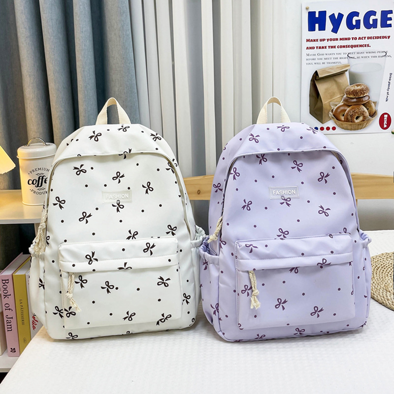Travel backpack for girls, fresh and large capacity 2025 new cartoon cute and fashionable backpack, trendy bow bag full figure