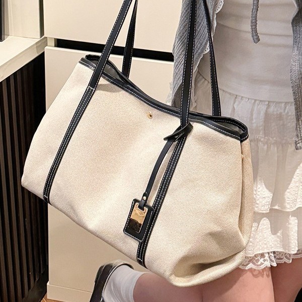 High-end patchwork canvas large-capacity tote bag for women 2025 new style commuting casual shopping bag, single-shoulder armpit bag full figure