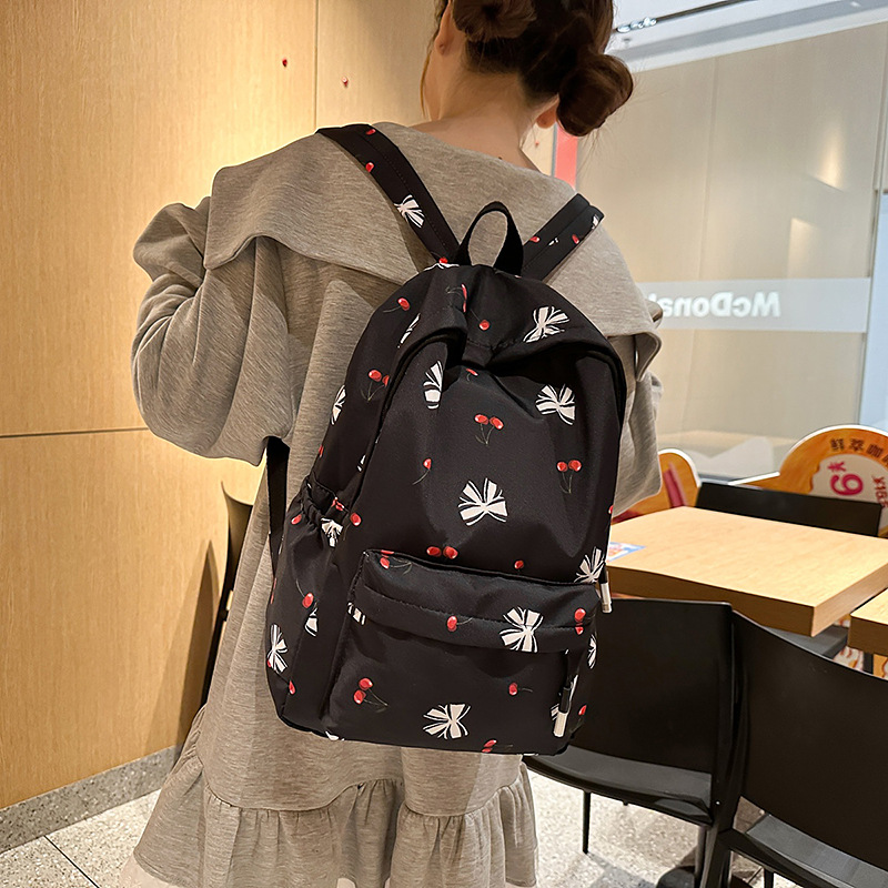 Korean-style fresh and simple schoolbag for female college students with small floral prints, lightweight and large-capacity backpack for high school students details Picture