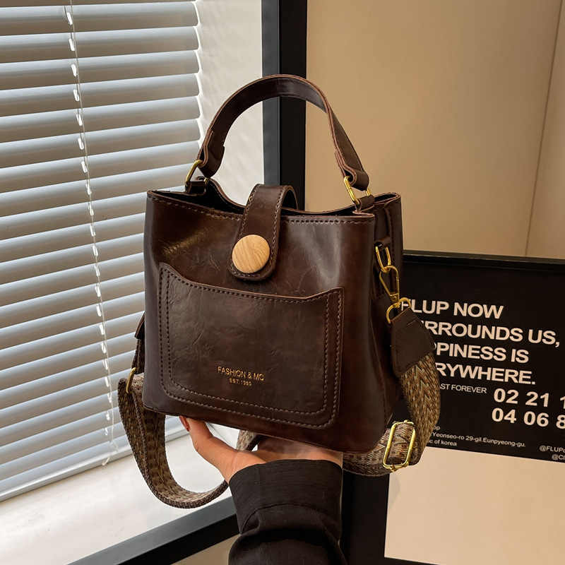 Bucket bag for women 2023 new style, solid color, high-end, retro, niche, wide-shoulder crossbody bag, hand-held small bag details Picture