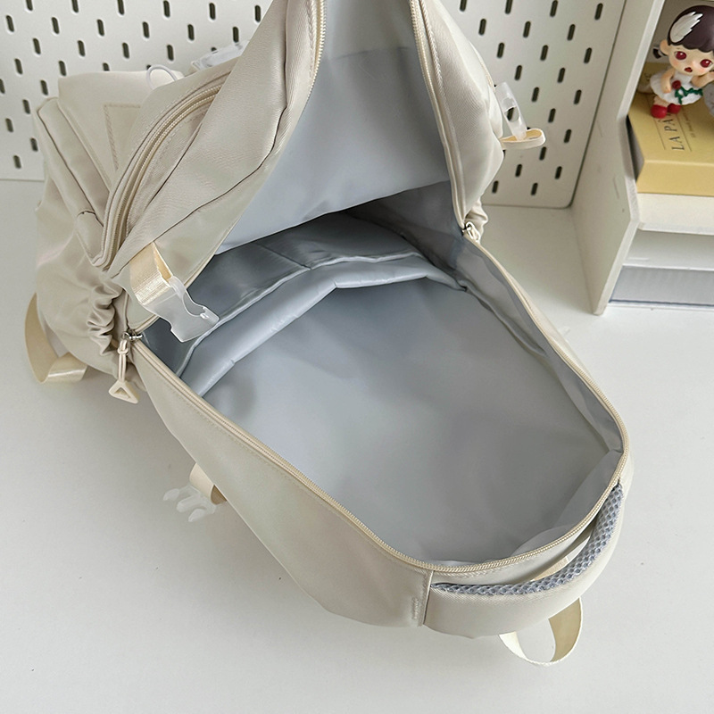 Japanese-style ins campus casual solid-color schoolbag, simple and versatile, lightweight couple backpack, high school and college student backpack Application Scenario