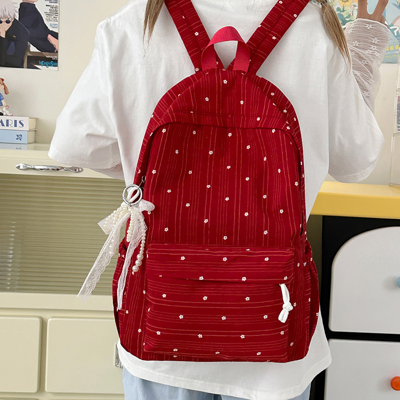 A new, lightweight and durable Japanese-style floral mini backpack that is versatile and suitable for college students full figure