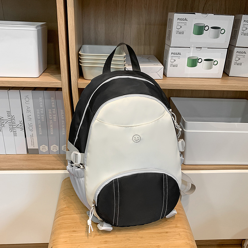 This Korean-style cute backpack is a new and simple schoolbag. It's fashionable, simple, casual and versatile, suitable for both boys and girls to go to school full figure