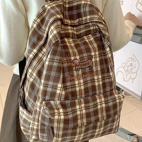 The new large-capacity backpack with a checkered pattern and a fresh and cute school style, the lightweight backpack, and the new forest-themed bag for autumn and winter full figure