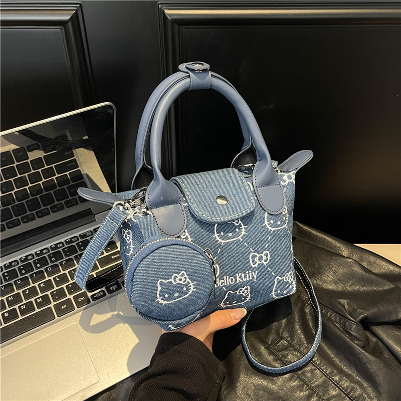 A high-end and fashionable new student print handbag, soft skin dumpling bag, cute large-capacity single-shoulder bag, crossbody bag full figure