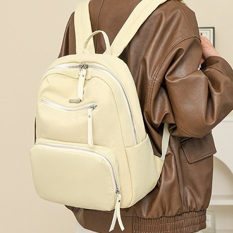 A new Korean version of a trendy and casual backpack for women, a large-capacity student backpack, and a fashionable Oxford fabric outdoor travel backpack full figure