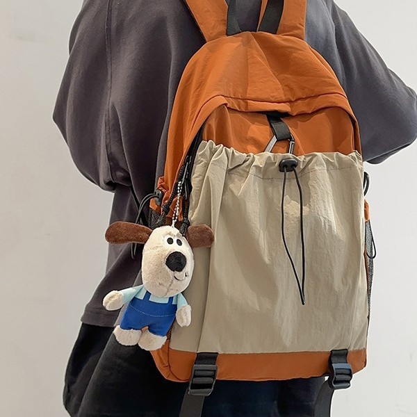 The new autumn and winter color-blocking backpack with a school style and large capacity design is an outdoor sports backpack suitable for both men and women full figure