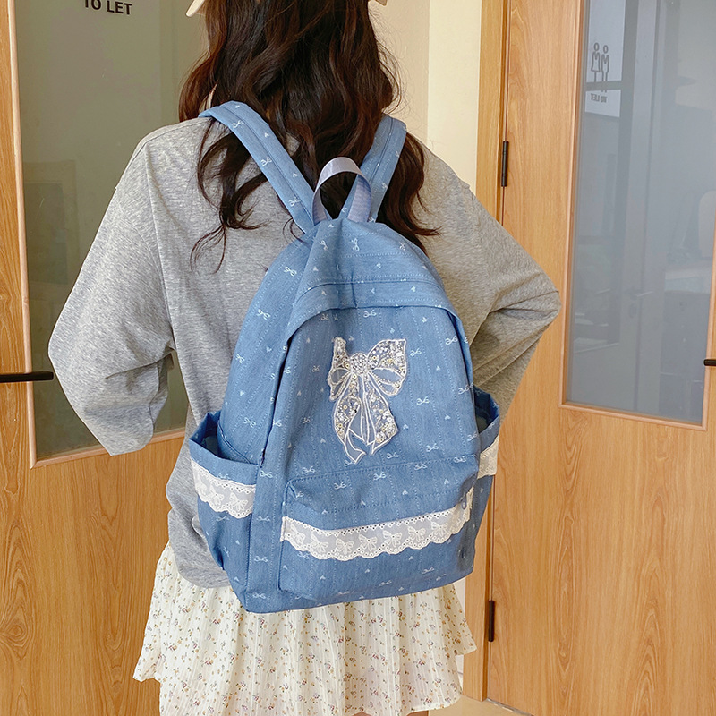 A new Japanese-style niche butterfly double-shoulder junior high school backpack with large capacity 2025 for casual and fashionable college students going out Application Scenario