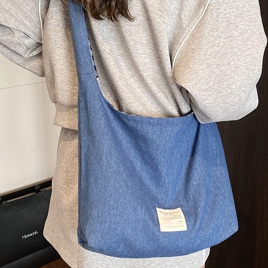 The new American denim double-sided backpack is versatile, with a large capacity checkered bag, a simple solid color tote bag, and a casual commuting bag Application Scenario