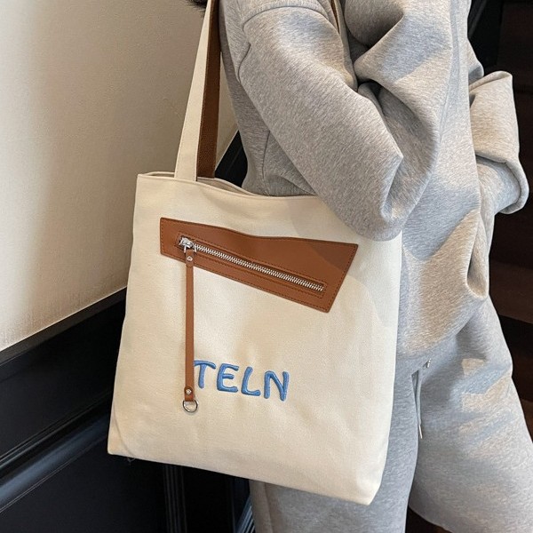 Color-blocking, fashionable, casual and versatile commuting canvas bag, large-capacity single-shoulder bag for women, hand-held special bag, and student book bag full figure