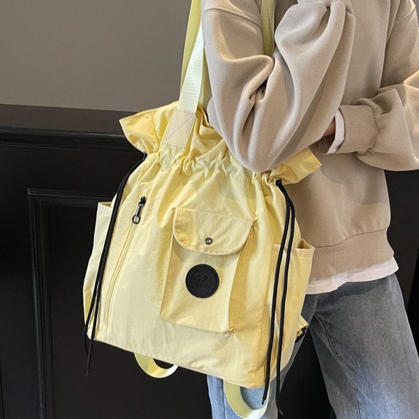 Lightweight backpack 2025 Spring New style Women's large-capacity versatile handbag, fashionable drawstring bag travel backpack full figure