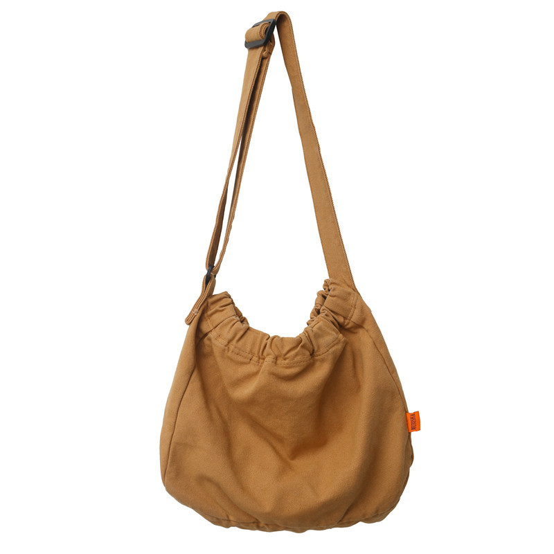 Laid-back Japanese-style artistic washed canvas bag for women, large capacity, simple solid color single-shoulder bag, pleated hand-held crossbody bag Item Picture