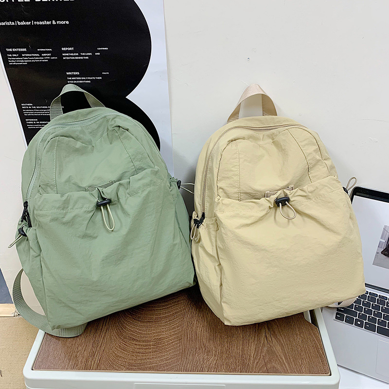 A new outdoor backpack in a trendy Korean style, with a unique pleated design, is casual and stylish, waterproof and has a large capacity. It is a lightweight backpack for college students full figure