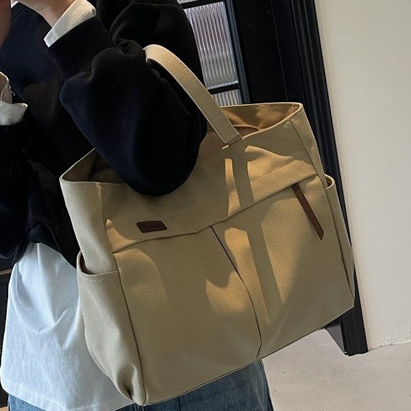Japanese and Korean artistic and simple hand-held shoulder canvas bag for women, a new Spring/Summer 2025 trendy and versatile commuter tote bag details Picture
