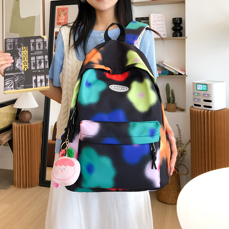 Cute flower junior high school student schoolbag, large-capacity tie-dyed colorful commuting backpack, niche design college student backpack full figure