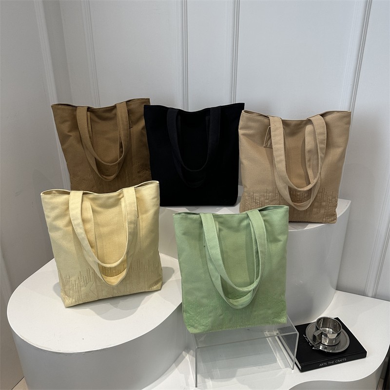 Fashionable and casual Korean-style embroidered canvas bag for women, 2024 new model student hand-held book bag for commuting, single-shoulder tote bag full figure