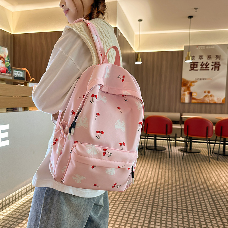 Korean-style fresh and simple schoolbag for female college students with small floral prints, lightweight and large-capacity backpack for high school students full figure