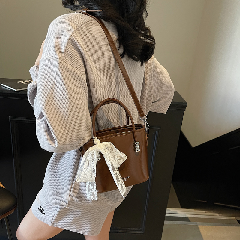 Simple and fashionable hand-held bucket bag for women, 2025 new retro high-end texture single-shoulder bag, trendy solid color crossbody bag Specification drawing