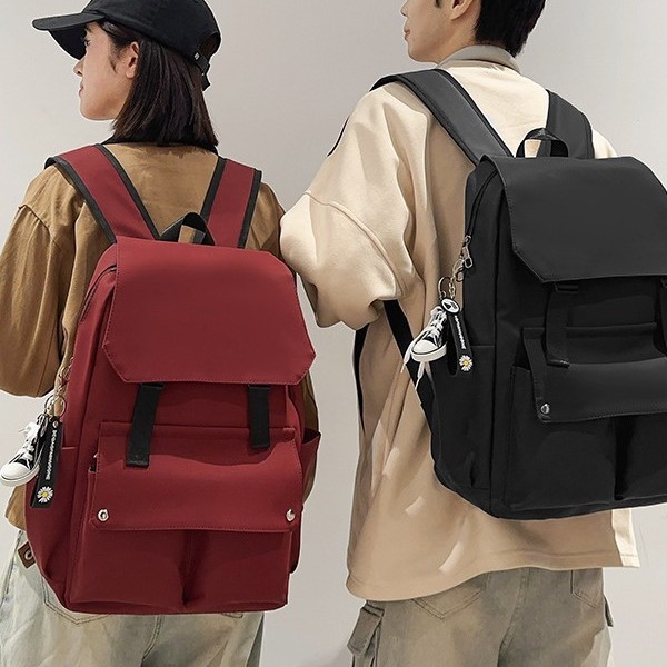 Korean-style ins fashion versatile large-capacity couple backpack for junior high school, senior high school and college students, solid-color multi-pocket travel backpack Application Scenario
