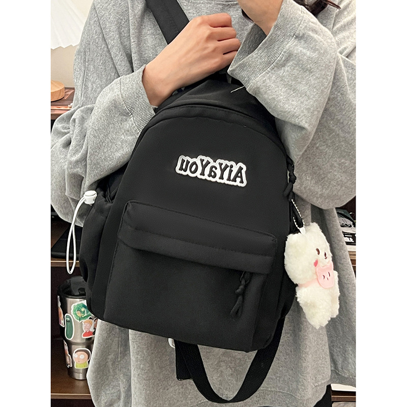 New cross-border primary school students' campus ultra-light and high-appearancelevel schoolbag, simple commuting niche backpack, spine support backpack Application Scenario