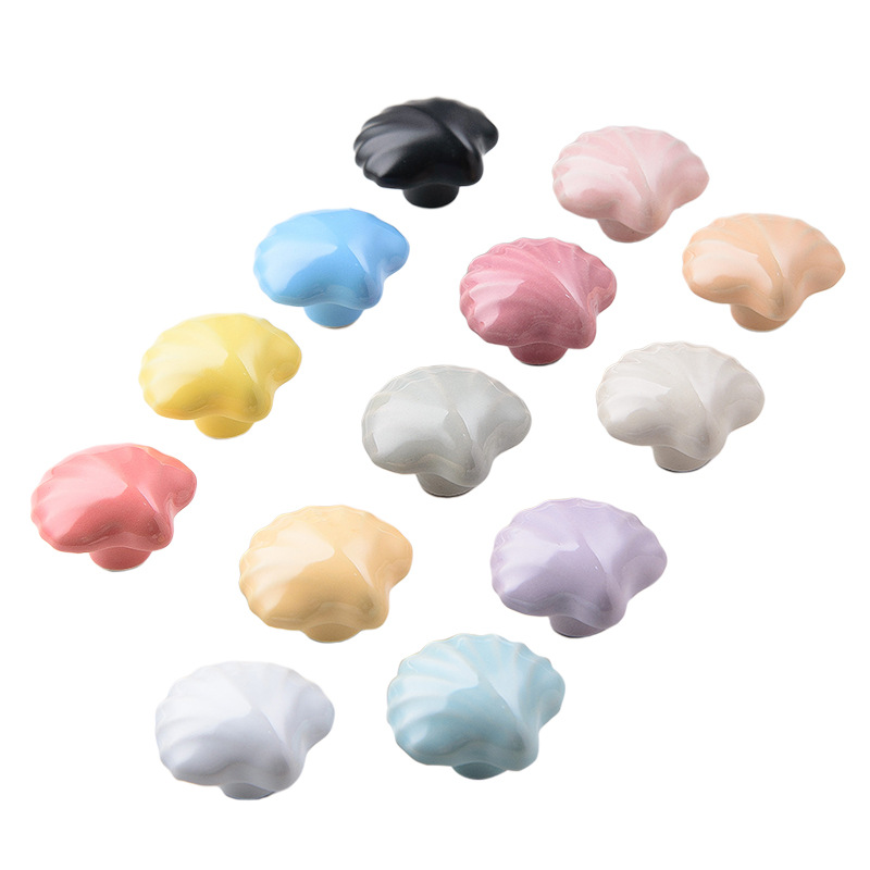 The manufacturer sells ceramic handles, Marine creative, simple and modern colored ceramic shell handles, cabinet doors, drawers and kitchen cabinets Item Picture