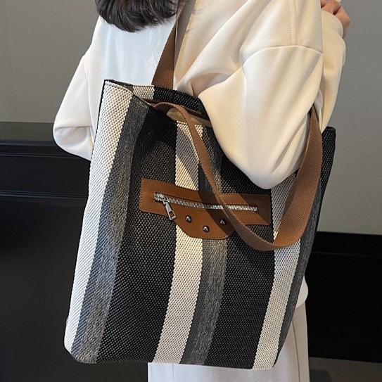 Autumn and winter versatile canvas large bag for women, 2024 new style fashionable striped tote bag, casual commuting single-shoulder armpit bag full figure