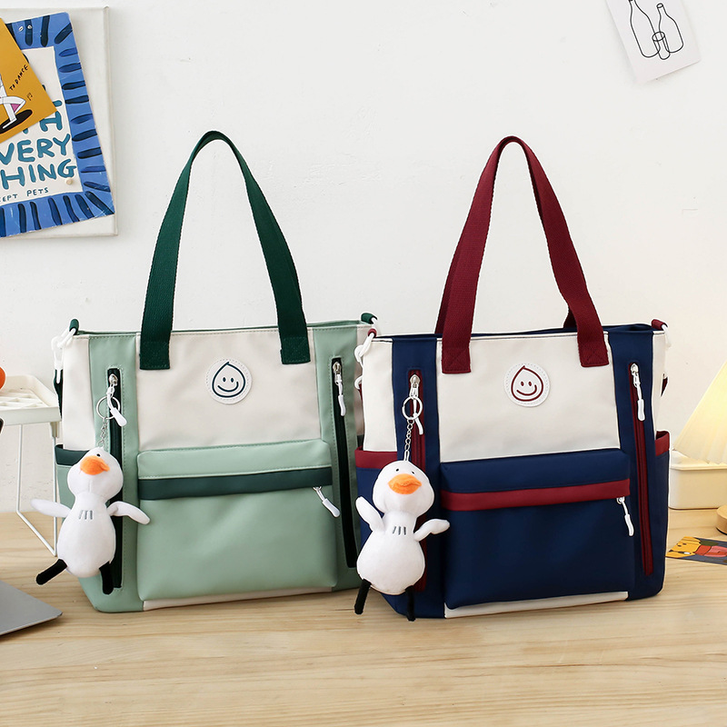 Color-blocking casual large-capacity tutorial bag, book bag for junior and senior high school students, hand-carried bag for class, high appearance level crossbody bag for girls full figure