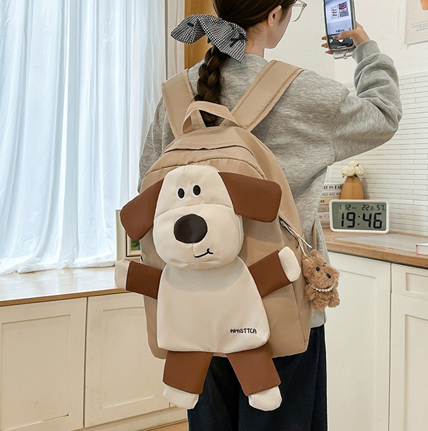 A sweet and cute cartoon dog backpack for girls, a new 2024 campus primary school student backpack with large capacity full figure