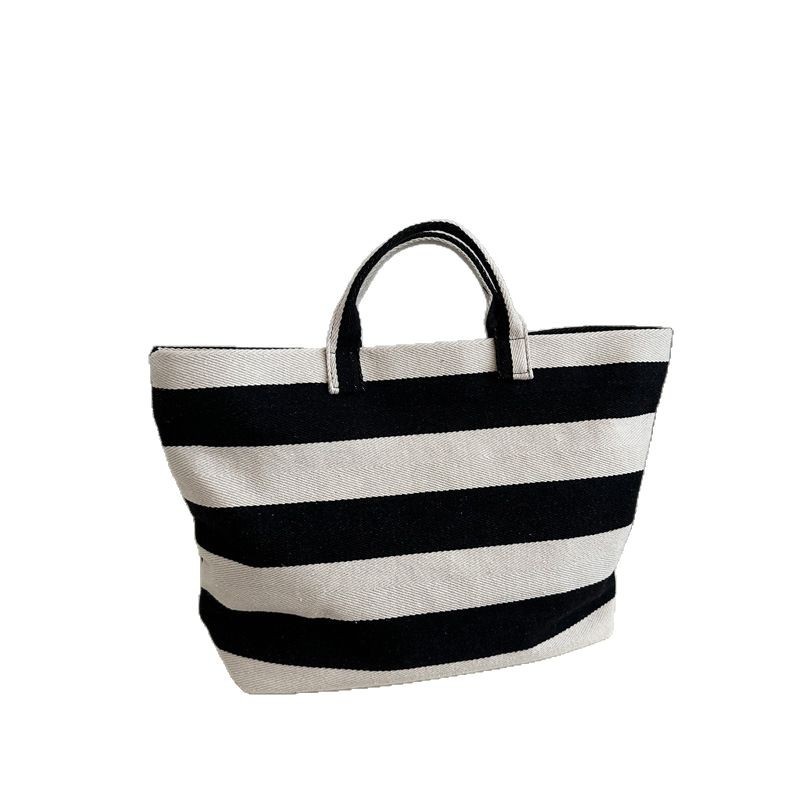Casual and fashionable Korean striped shopping bag, creative and fashionable women's handbag, lightweight and simple student canvas handbag Item Picture