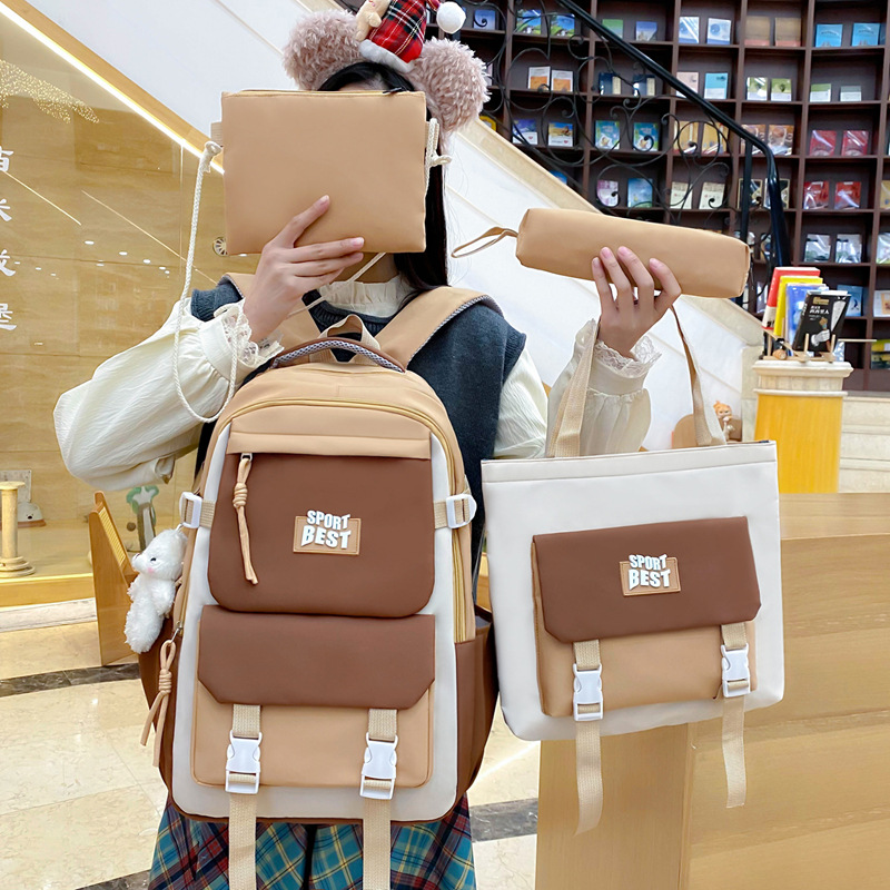 Trendy nylon four-piece set backpack in stock, fashionable color-blocking school backpack, large-capacity college student schoolbag for girls full figure