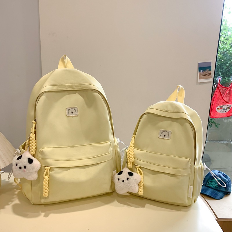 A new cross-border, niche, large-capacity, lightweight and simple Korean-style solid color large-capacity schoolbag suitable for both boys and girls in primary schools details Picture