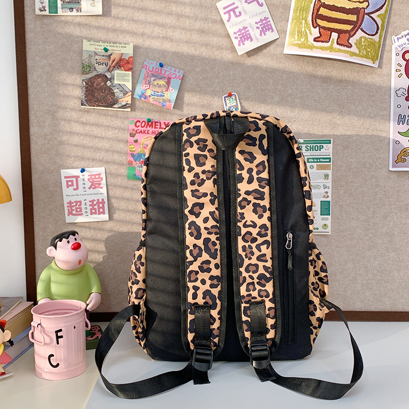 A cute Korean-style schoolbag with a niche design, featuring cartoon leopard print and a large capacity backpack for high school and college students Specification drawing