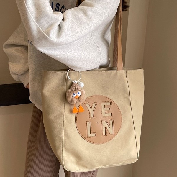 Large-capacity tote bag for women 2025, fashionable, casual and versatile canvas bag, niche hollowed-out high-end student single-shoulder bag details Picture